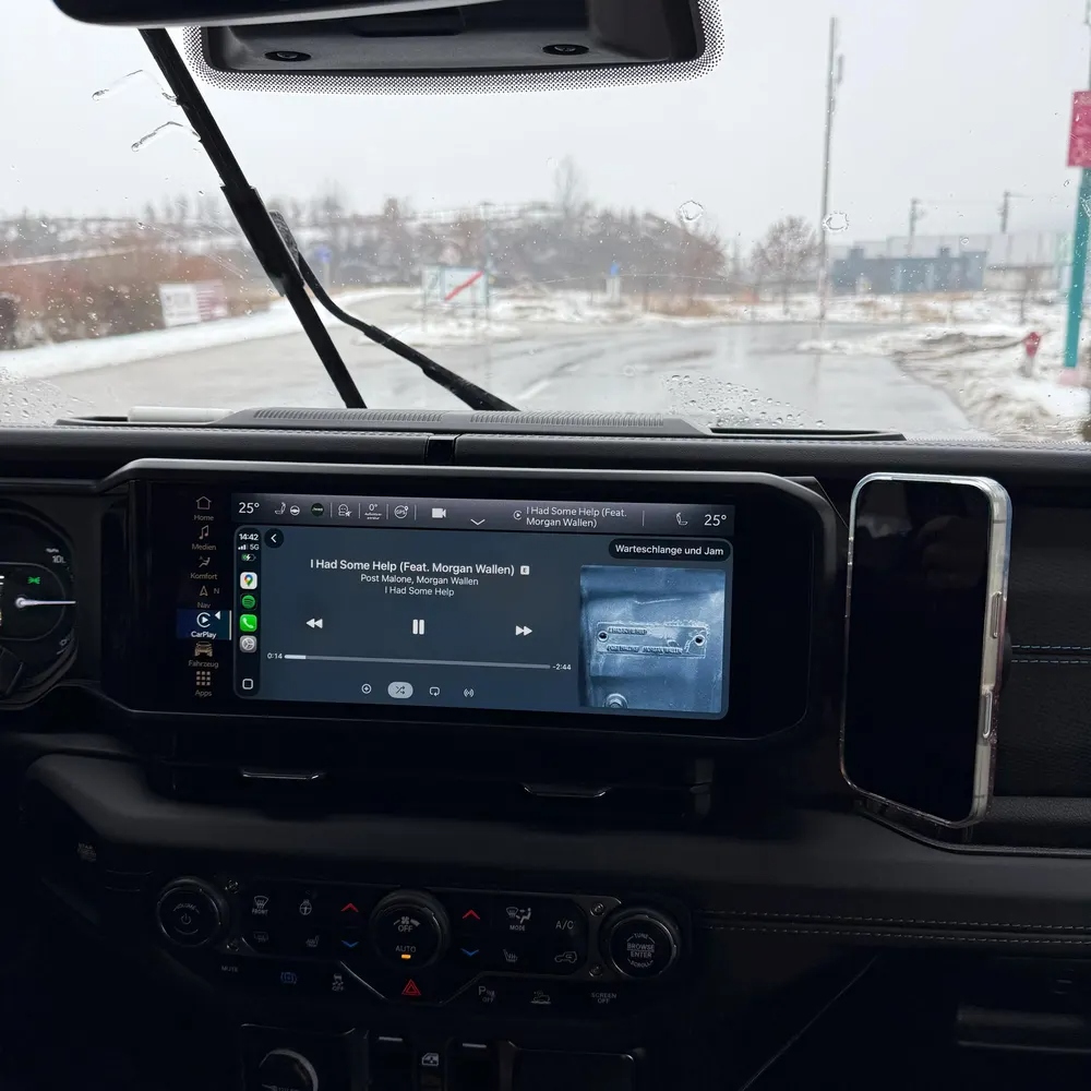 Black TrailMounts phone mount installed in Jeep Wrangler in Austria during winter
