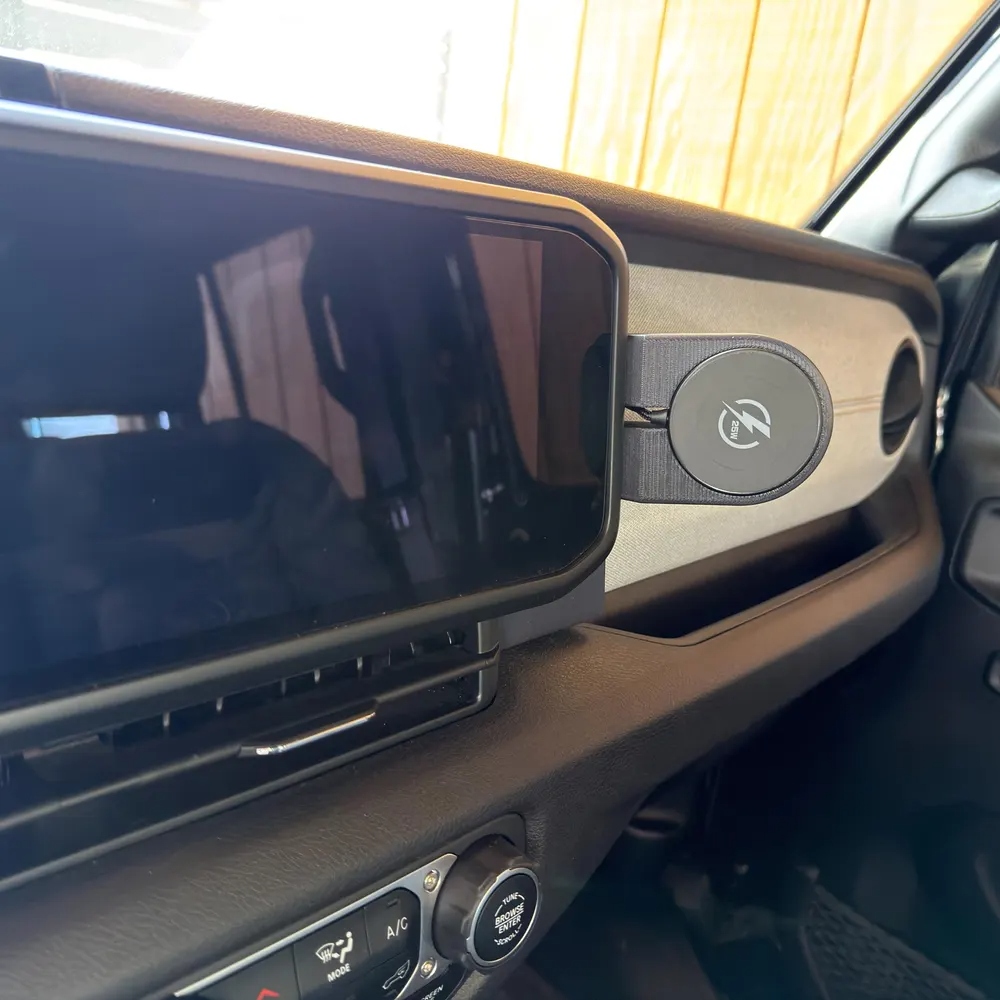 Black phone mount on tan Jeep interior showing perfect contrast
