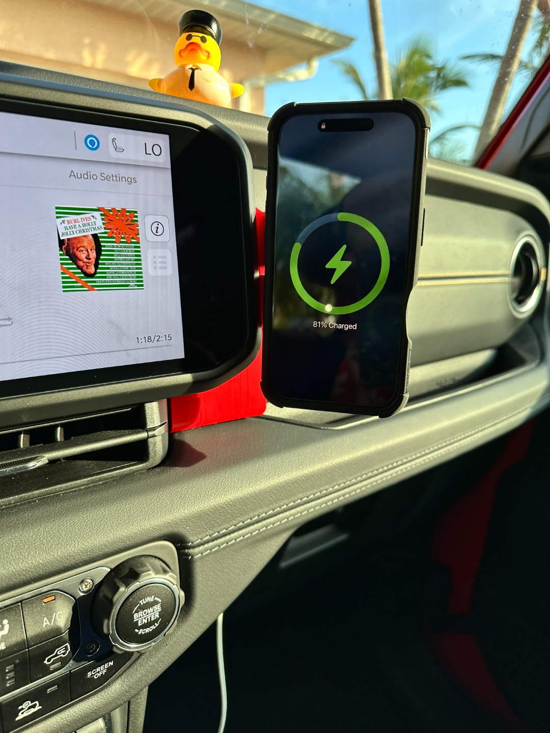 TrailMounts phone holder charger — precision machined detail view showing wireless charging pad and tool-free mounting hardware