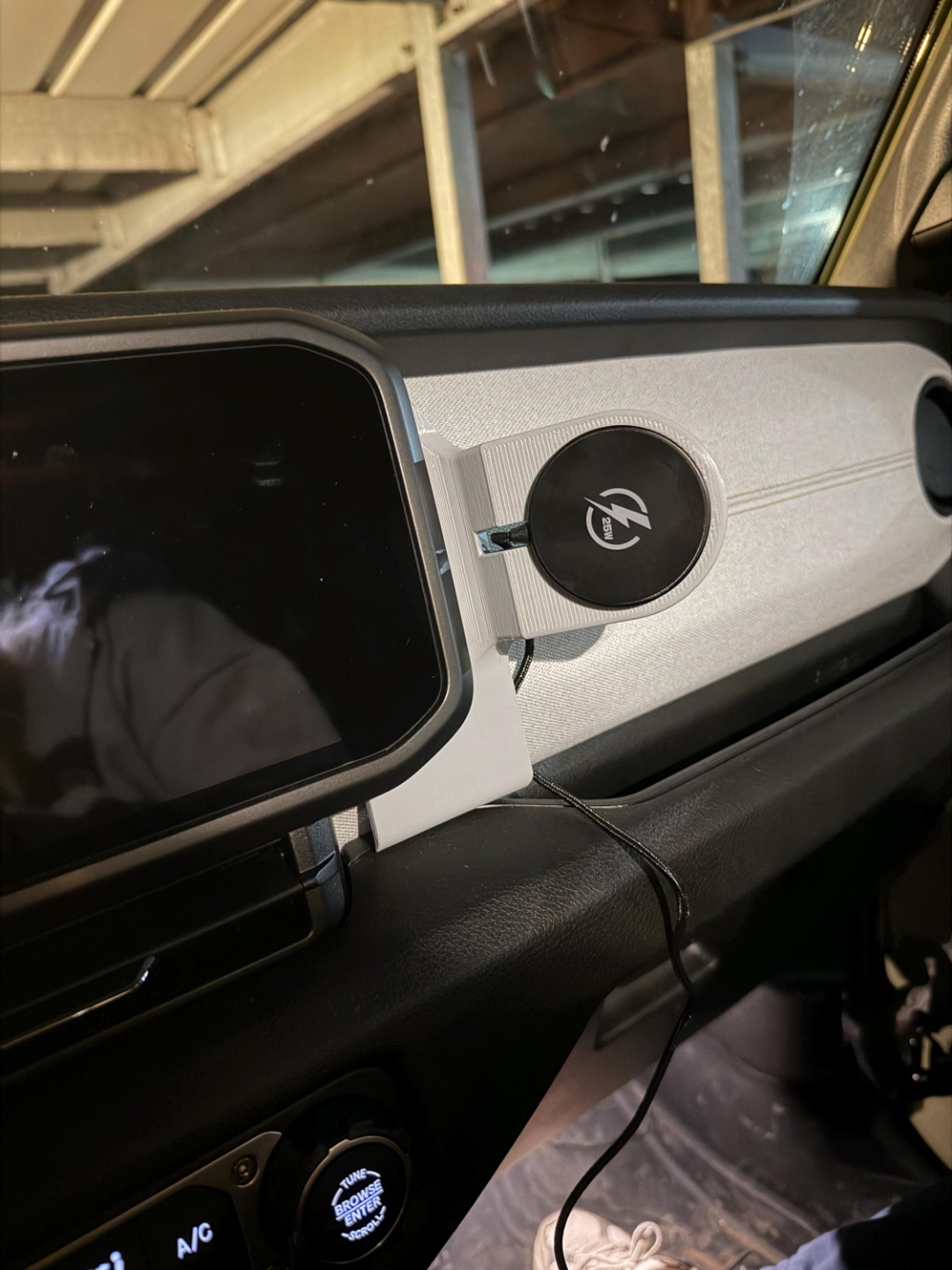 Gray TrailMounts Jeep Wrangler phone mount on cutting mat showing precision fit